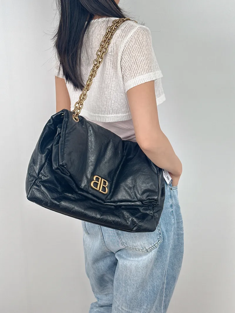 BALENCIAGA Shoulder Bag MONACO Chain Bag Black Calfskin Medium 34 × 15 × 24 cm — on-model view 2 of 3