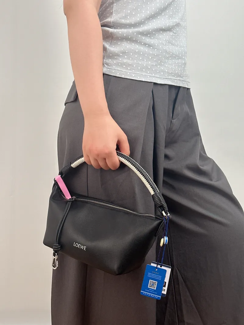 LOEWE Shoulder Bag Cala Woven Black White Lambskin Mini 26 × 10 × 13 cm — on-model view 1 of 3