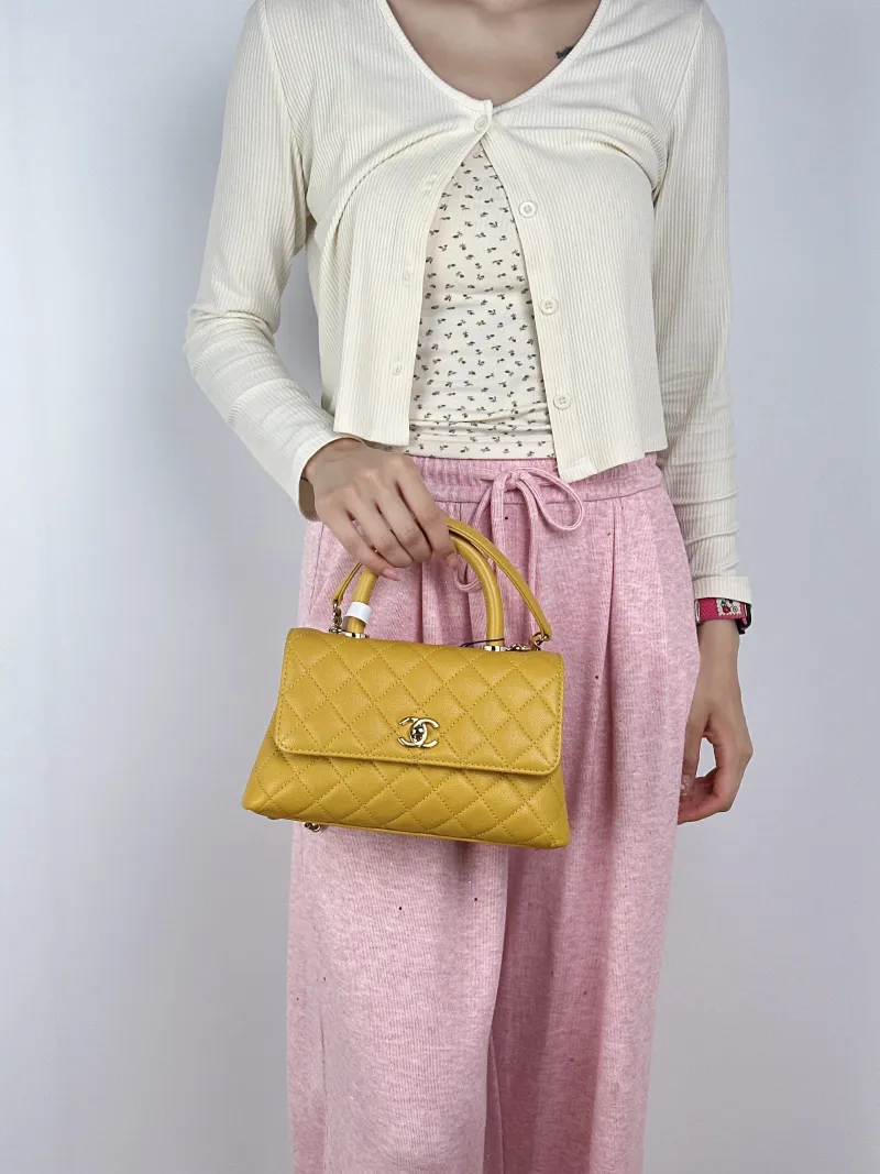 Chanel Crossbody Bag Coco Handle​ Yellow Calfskin Small24 × 10 × 14 cm — on-model view 2 of 2