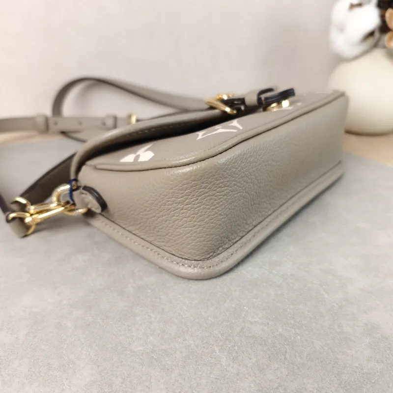 Louis Vuitton Crossbody Bag Diane Baguette Bag Empreinte Embossed Calfskin nano 19 × 6 × 10.5 cm — detail view 1 of 14