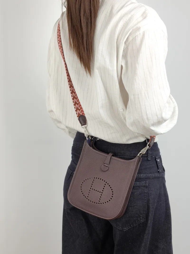 Hermès Crossbody Bag Evelyne Mini 16 Mini 16 0G Taurillon Clemence TC Calfskin Mini 17 × 5.5 × 18 cm B — on-model view 1 of 2