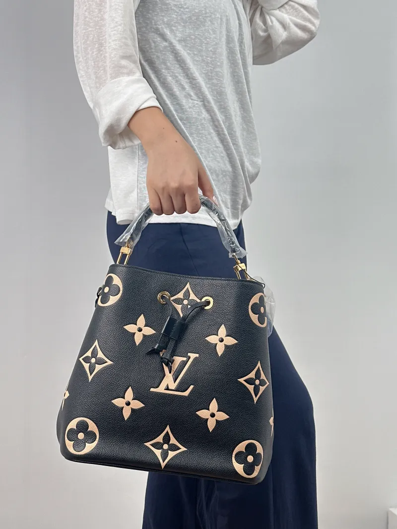 Louis Vuitton Shoulder Bag NÉONOÉ Bucket Bag Black · White Monogram Empreinte Embossed Calfskin Medium 26 × 17.5 × 26 cm — on-model view 2 of 2
