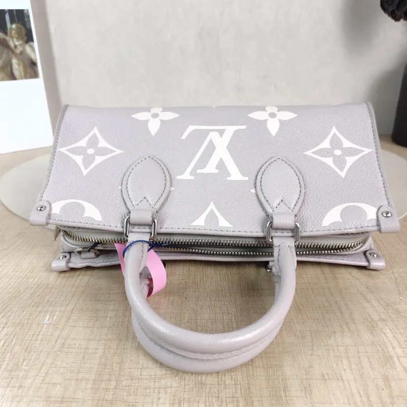 Louis Vuitton Crossbody Bag Onthego East West Two Straps Grey Monogram Empreinte Embossed Calfskin Small 25 × 10 × 13 cm — detail view 10 of 12