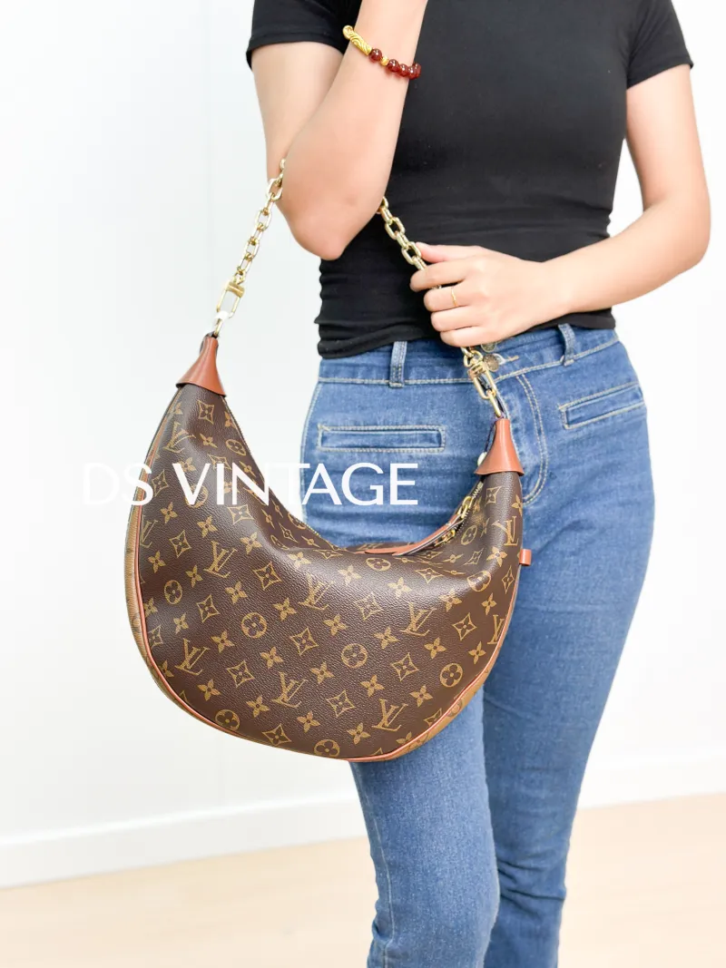 Louis Vuitton Crossbody Bag Loop Hobo Monogram PVC One Size38 × 10 × 26 cm — on-model view 1 of 3