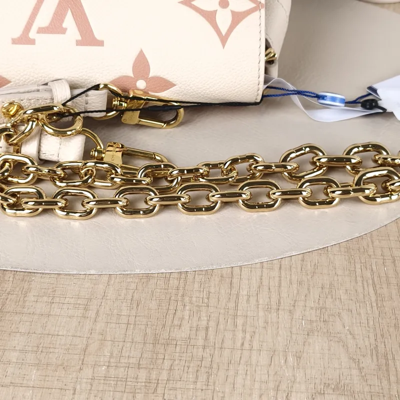 Louis Vuitton Crossbody Bag Favorite White · Pink Empreinte Embossed Calfskin Monogram Medium24 × 9 × 14 cm — detail view 11 of 12