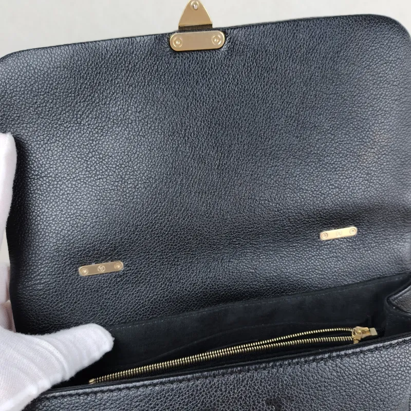 Louis Vuitton Crossbody Bag MADELEINE Black Monogram Empreinte Embossed Calfskin Medium 30 × 11 × 19.5 cm — detail view 1 of 11
