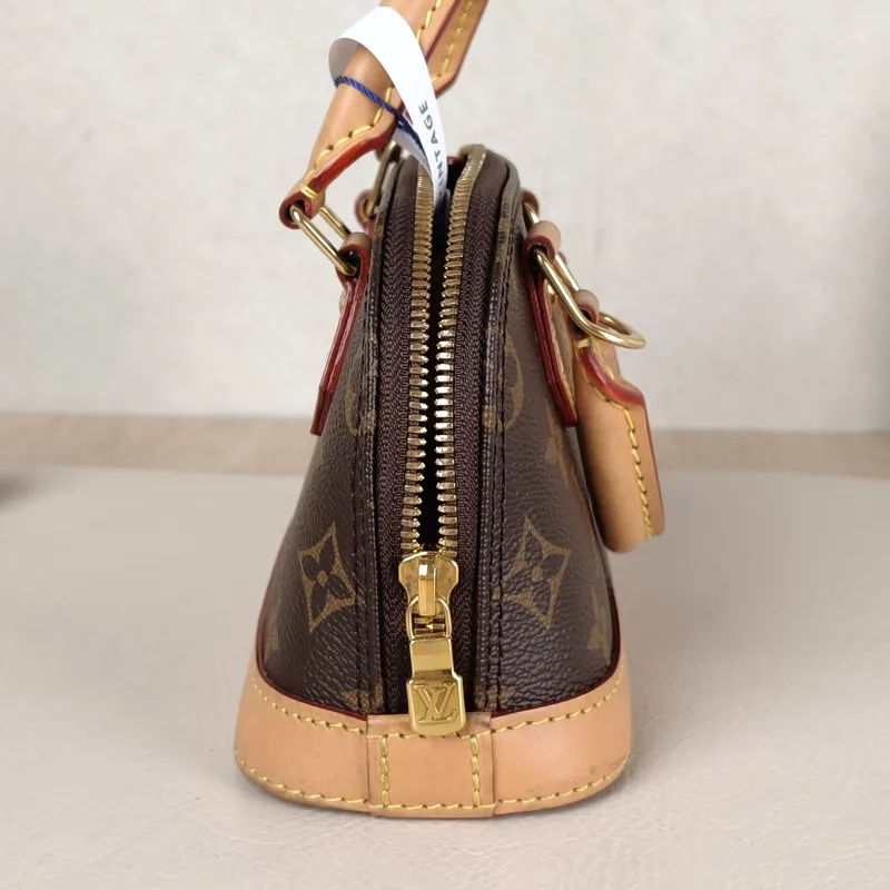 Louis Vuitton Crossbody Bag Alma Nano Monogram PVC nano 18 × 8 × 12 cm — detail view 9 of 9