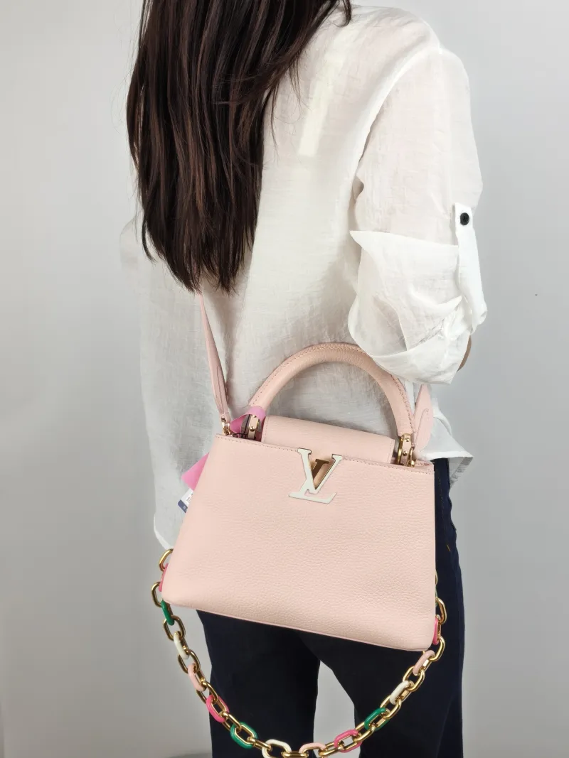 Louis Vuitton Top Handle Bag Capucines Pink Calfskin BB 27 × 9 × 17.5 cm — on-model view 3 of 3