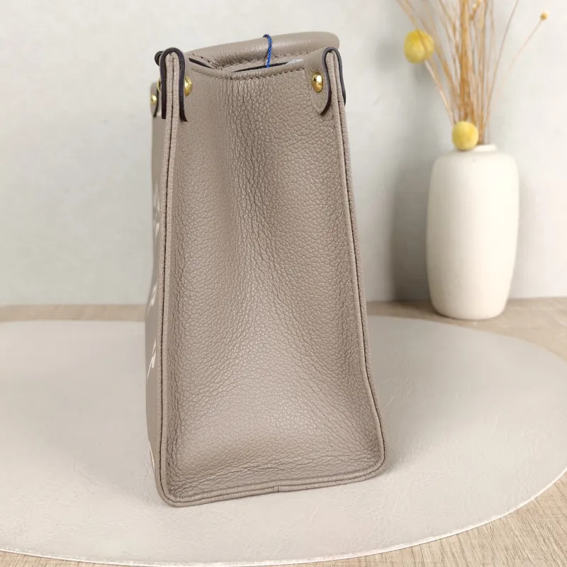 Louis Vuitton Shoulder Bag Onthego · White Monogram Empreinte Embossed Calfskin Small 25 × 11.5 × 19 cm — detail view 9 of 12