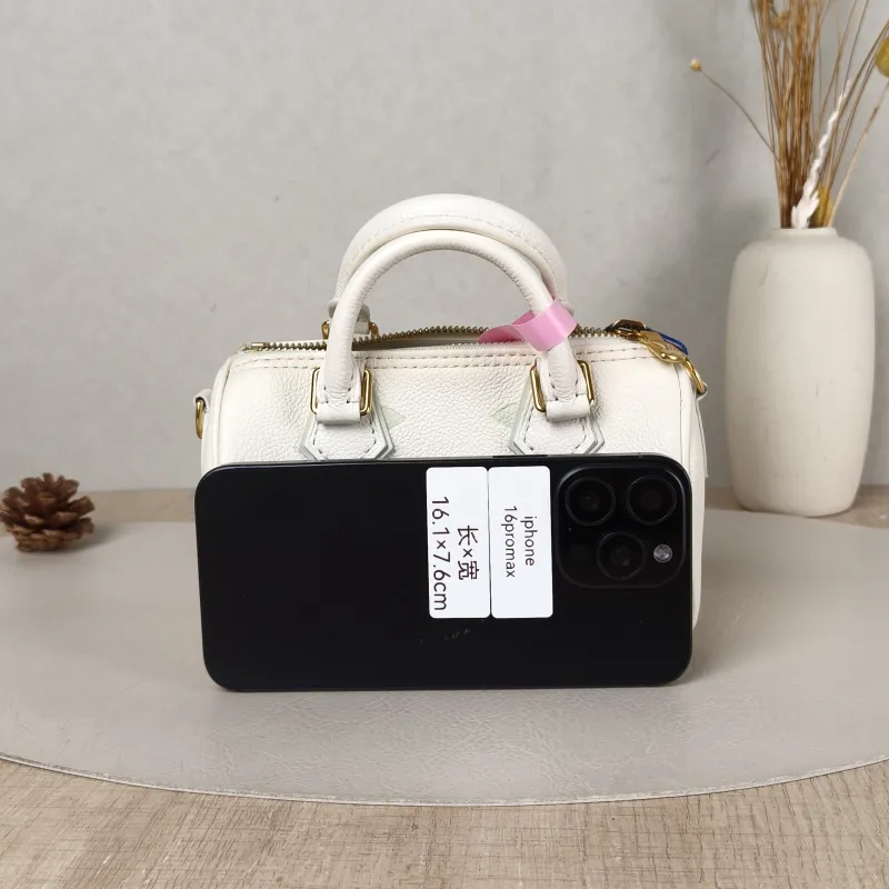 Louis Vuitton Crossbody Bag Speedy Nano White · Green Empreinte Embossed Calfskin nano 16 × 7.5 × 10 cm — cover view 4 of 5