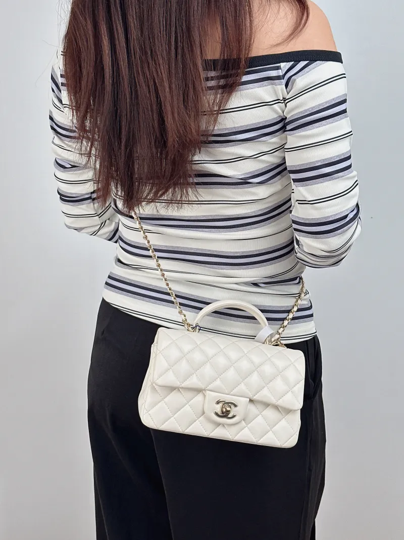 Chanel Crossbody Bag mini White Lambskin mini 20 × 6 × 12 cm — on-model view 1 of 2