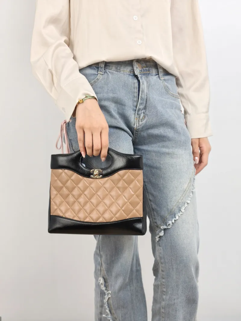 Chanel Crossbody Bag 31Bag Beige Black Lambskin Mini 23 × 5.5 × 22 cm — on-model view 1 of 2
