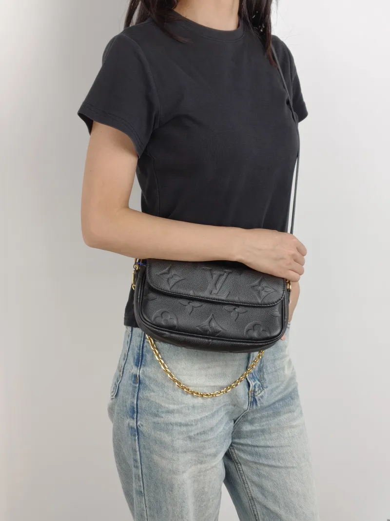 Louis Vuitton Crossbody Bag IVY Black Empreinte Embossed Calfskin Small 23.5 × 4.3 × 12 cm — on-model view 1 of 3