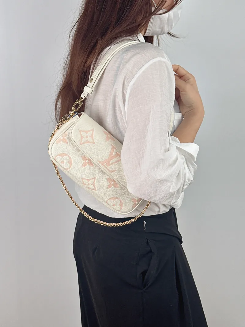 Louis Vuitton Crossbody Bag IVY White · Pink Monogram Empreinte Embossed Calfskin Small 23.5 × 4.3 × 12 cm — on-model view 2 of 2