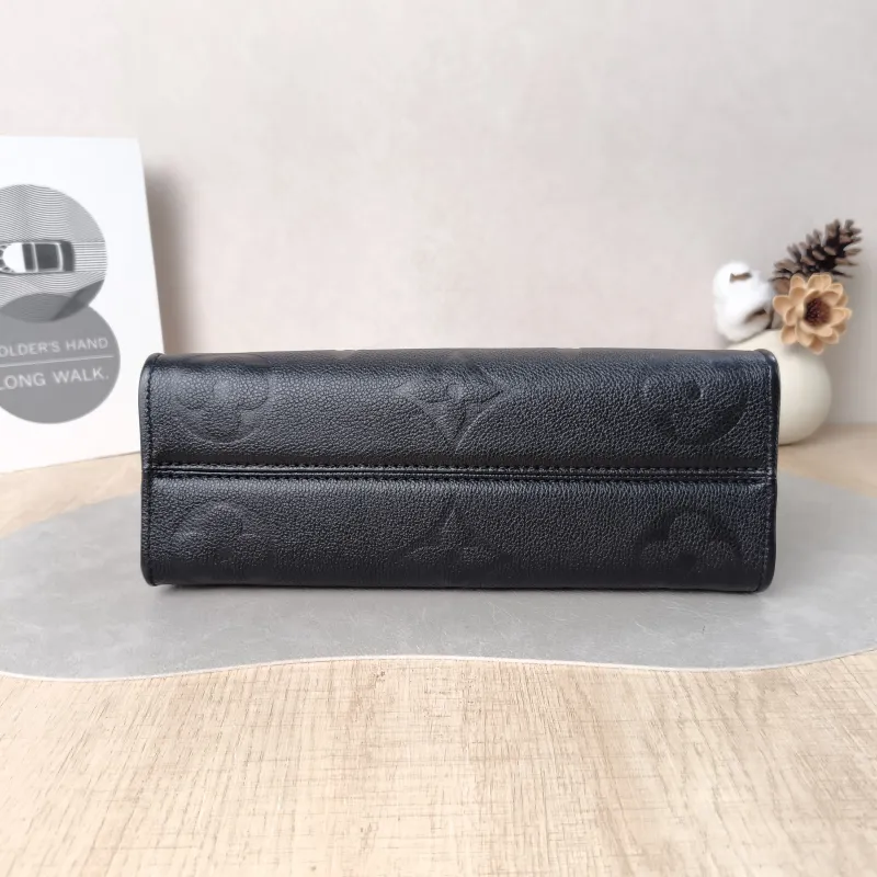 Louis Vuitton Crossbody Bag Onthego East West Two Straps Black Monogram Empreinte Embossed Calfskin Small 25 × 10 × 13 cm — cover view 3 of 6