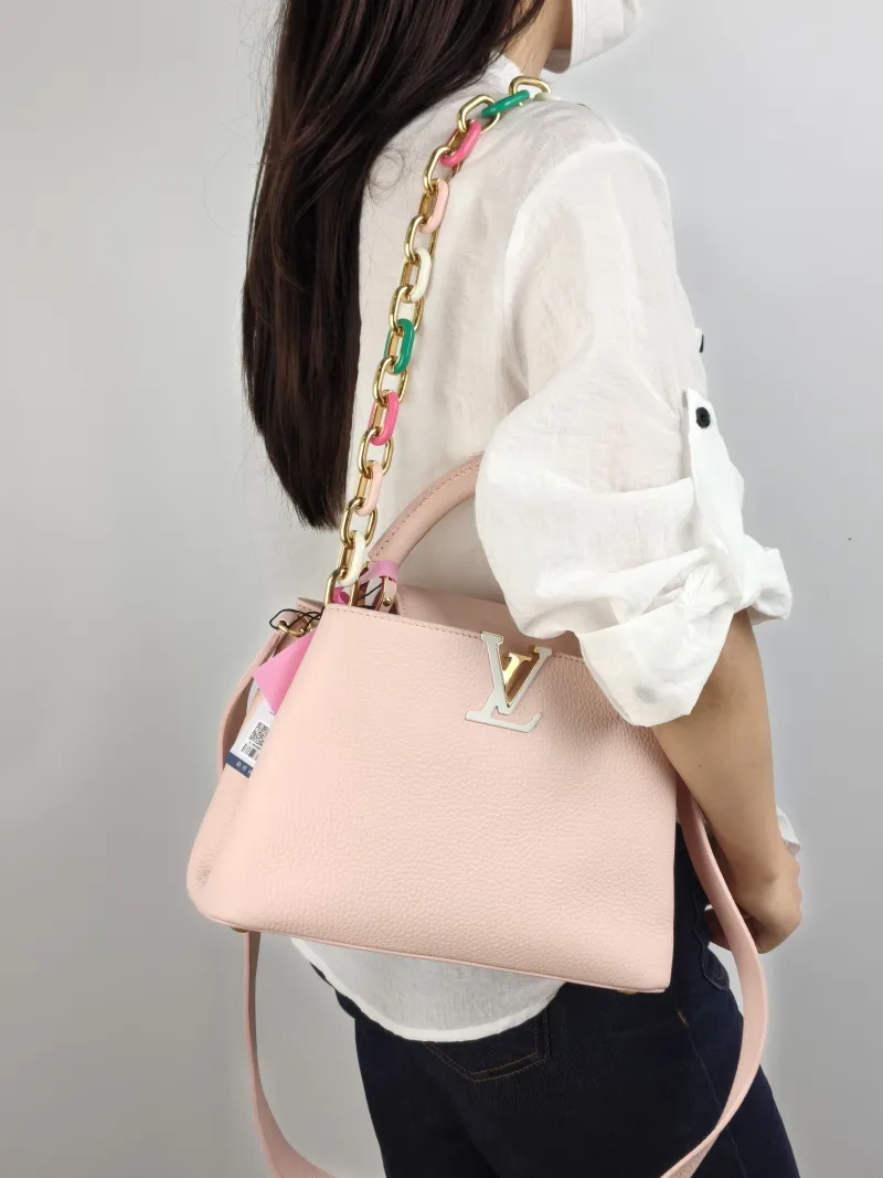 Louis Vuitton Top Handle Bag Capucines Pink Calfskin BB 27 × 9 × 17.5 cm — on-model view 2 of 3