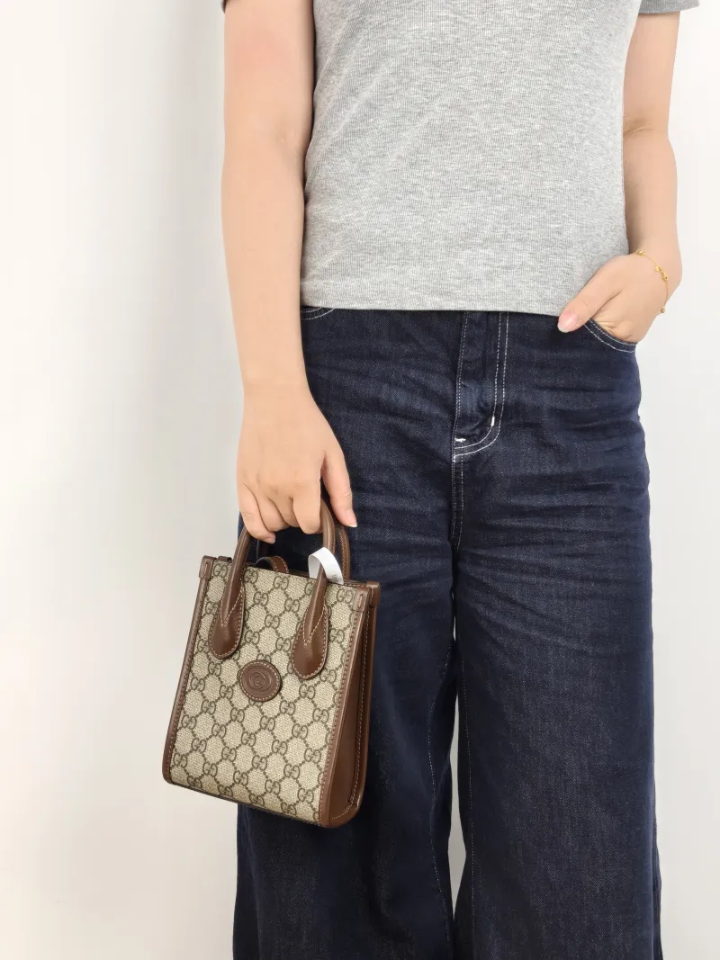 GUCCI Crossbody Bag GG Retro Collection Tote Bag Brown PVC Mini 16 × 7 × 20 cm — on-model view 2 of 2