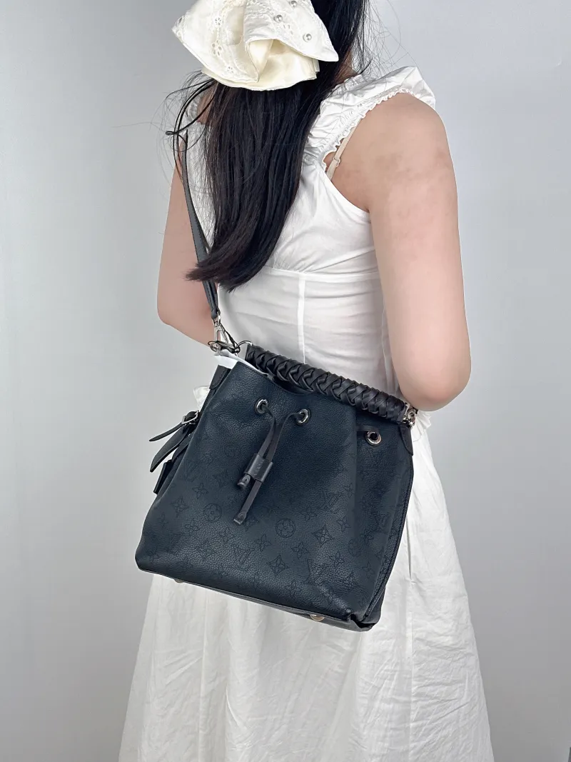 Louis Vuitton Shoulder Bag Muria Black Calfskin One Size26 × 14 × 26 cm — on-model view 1 of 3