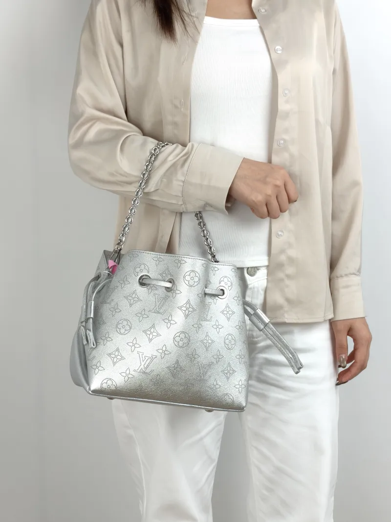 Louis Vuitton Crossbody Bag BELLA White Lambskin One Size 22 × 14 × 19 cm — on-model view 1 of 2