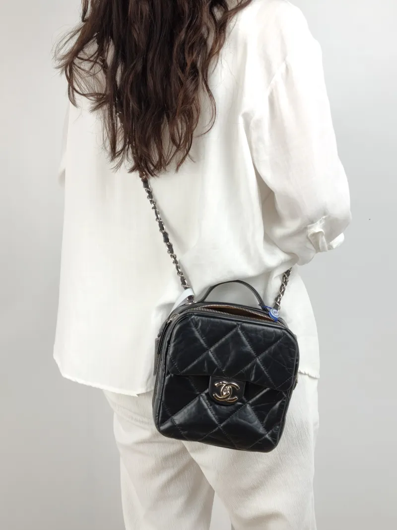 Chanel Crossbody Bag Camera Bag Black Waxed Leather 16.5 × 8.5 × 18 cm 28 — on-model view 1 of 2