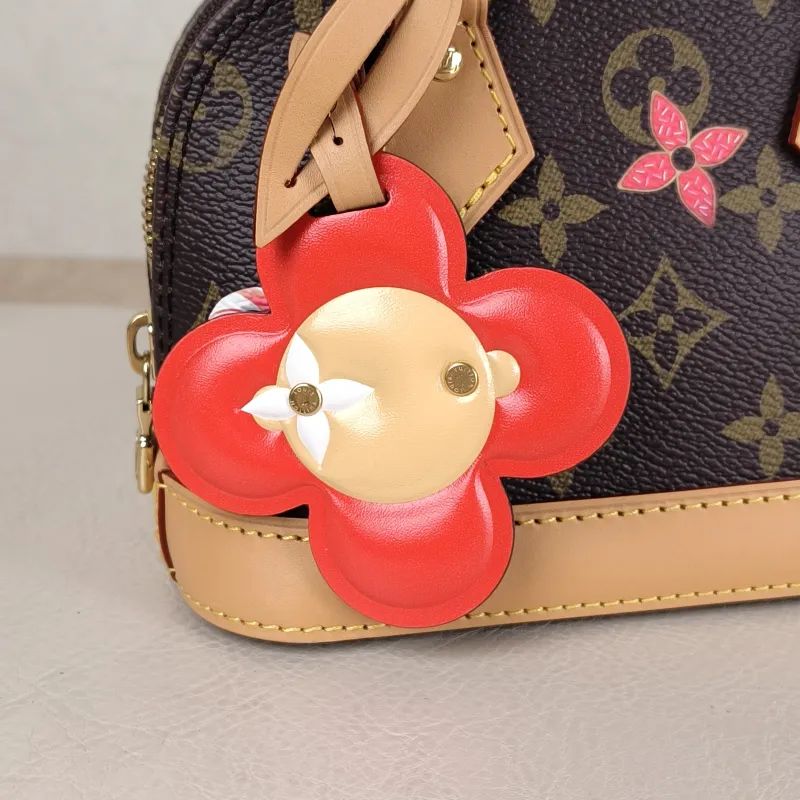 Louis Vuitton Crossbody Bag Alma Nano vivenne Monogram PVC nano 18 × 8 × 12 cm — detail view 2 of 11
