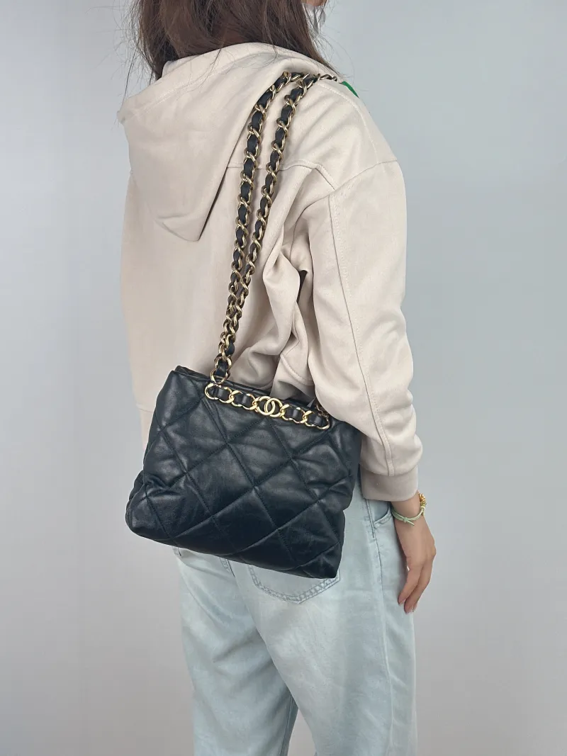Chanel Shoulder Bag 22b Small Shopping Tote Black Lambskin Small 25 × 10 × 20 cm — on-model view 2 of 2