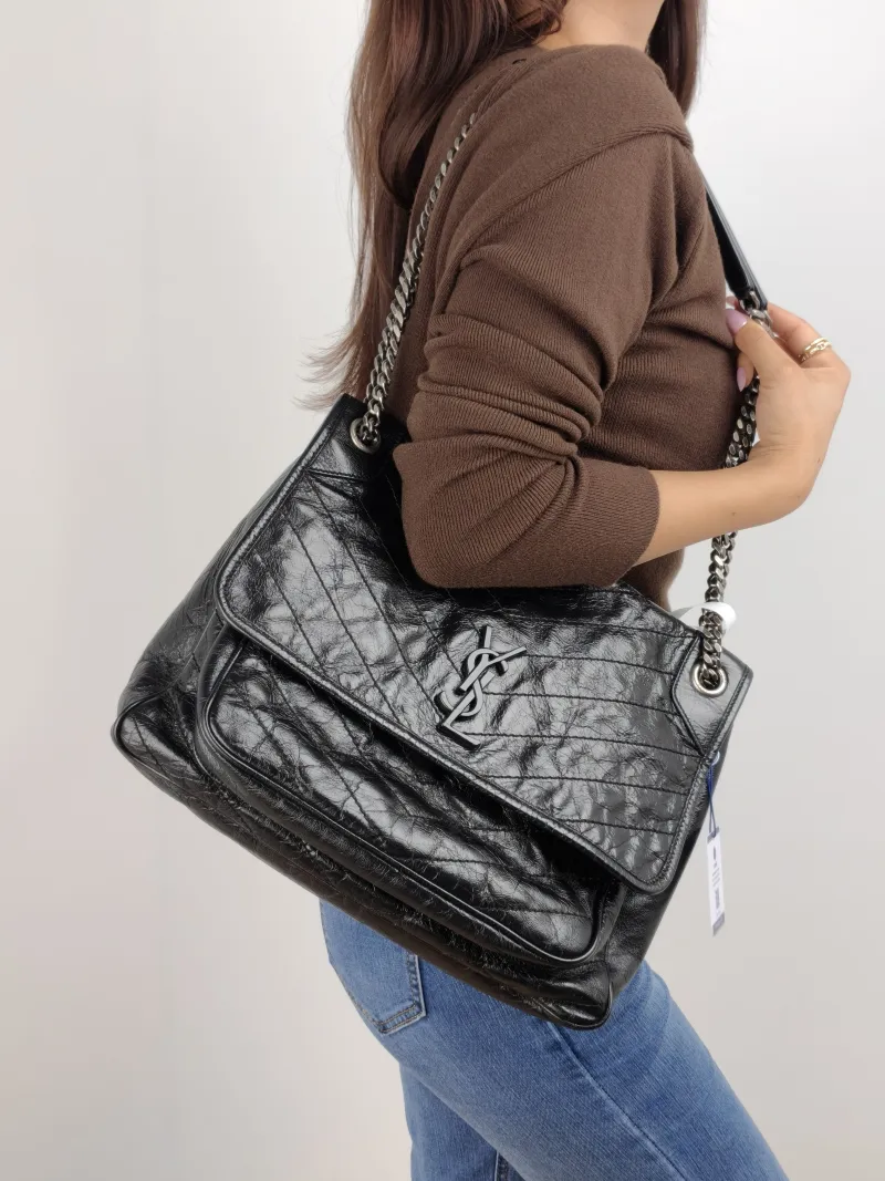 SAINT LAURENT Crossbody Bag Niki D Waxed Leather Calfskin Large 32 × 9 × 23 cm — on-model view 2 of 2