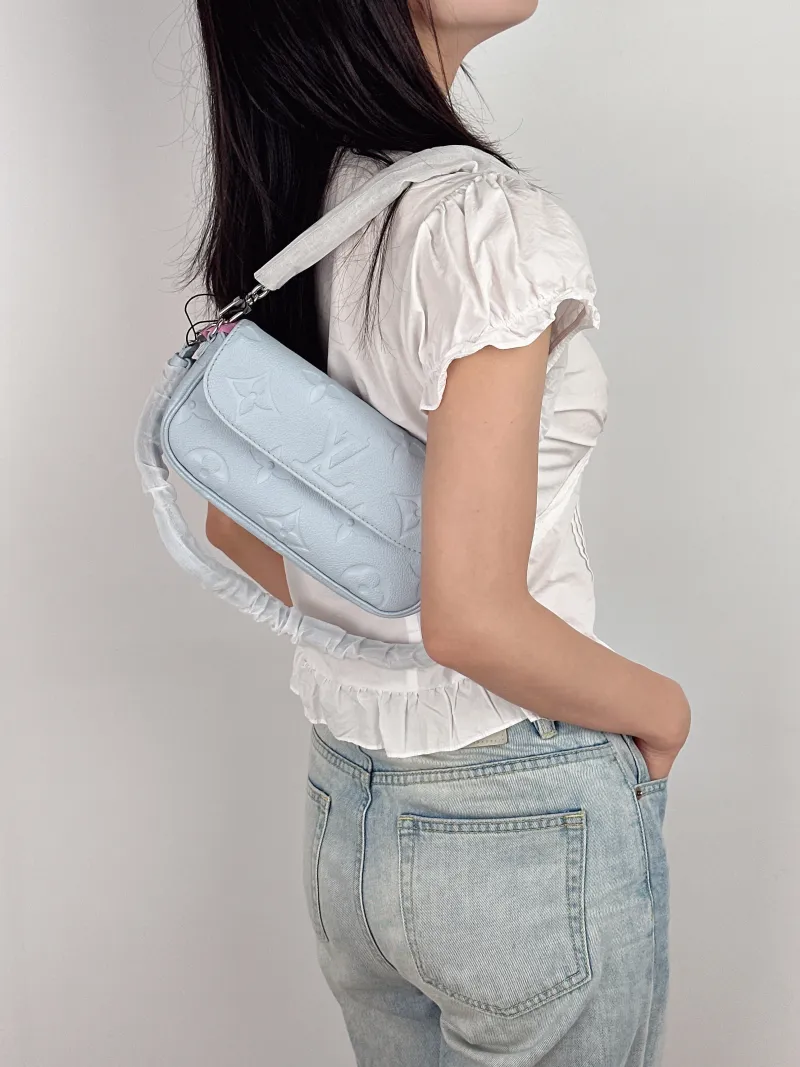 Louis Vuitton Crossbody Bag IVY Blue Empreinte Embossed Calfskin Small 23.5 × 4.3 × 12 cm — on-model view 3 of 3