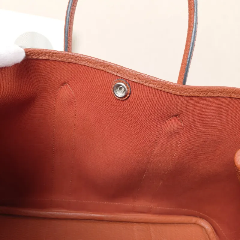 Hermès Top Handle Bag Garden Party 30 30 Canvas · Negonda Calfskin Medium30 × 13 × 21 cm — detail view 12 of 12