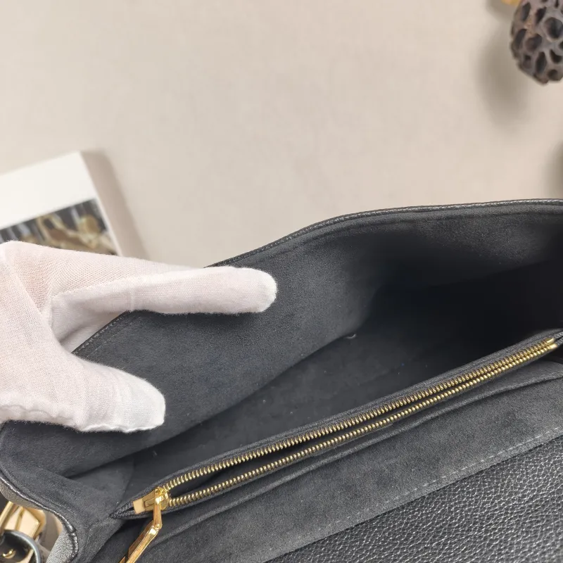 Louis Vuitton Crossbody Bag MADELEINE Black Monogram Empreinte Embossed Calfskin Medium 30 × 11 × 19.5 cm — detail view 8 of 12