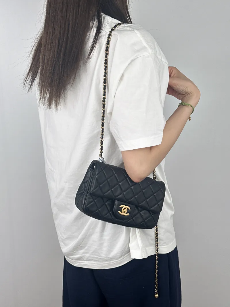 Chanel Crossbody Bag Classic Flap Large Mini CF Mini Black with Gold-Tone Hardware Lambskin mini20 × 6 × 12 cm — on-model view 1 of 2