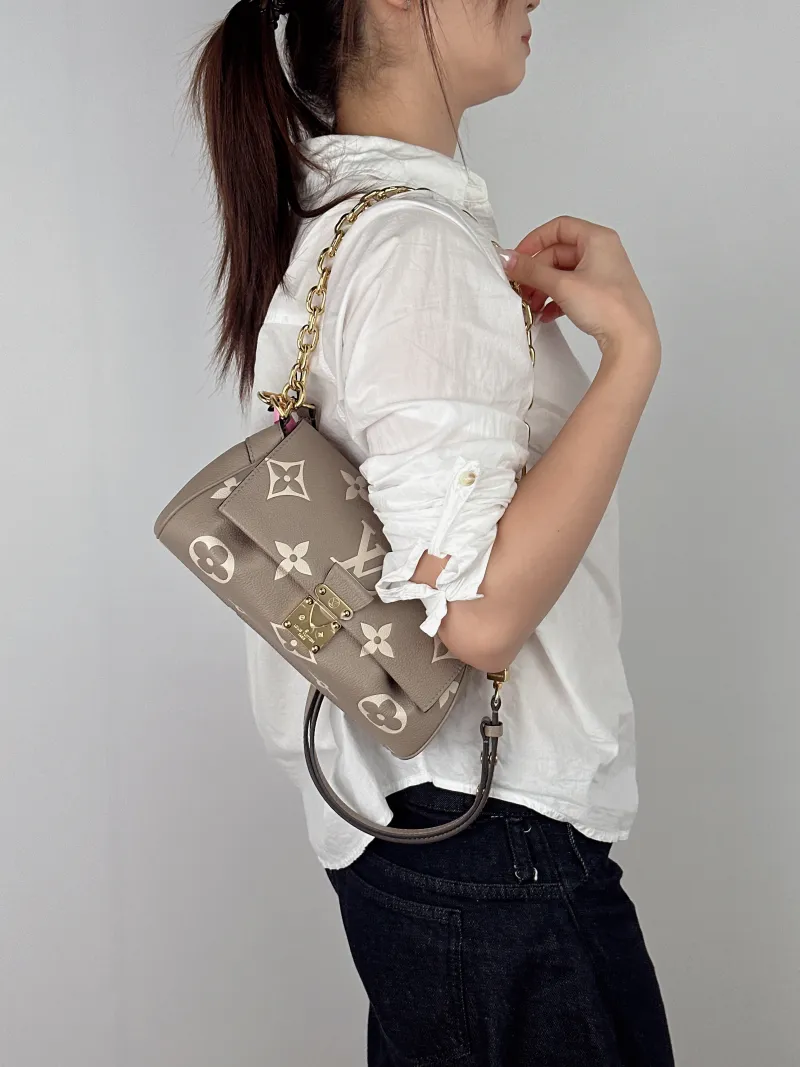 Louis Vuitton Crossbody Bag Favorite Empreinte Embossed Calfskin Medium24 × 9 × 14 cm — on-model view 2 of 3