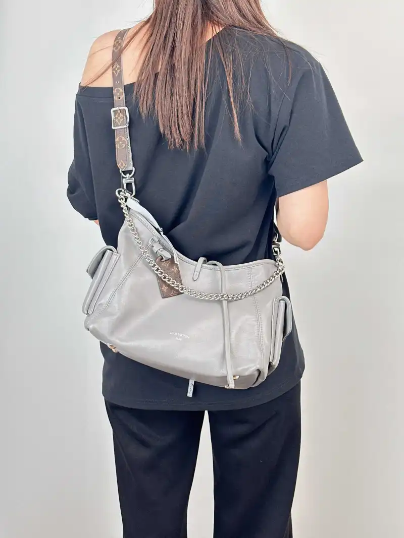 Louis Vuitton Crossbody Bag Carryall Cargo Vibe Grey SL ambskin Small 33.5 × 15 × 23 cm — on-model view 1 of 2