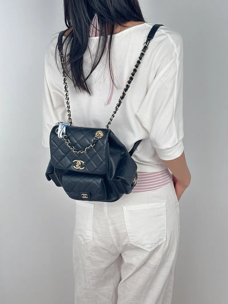 Chanel Backpackduma Black Grained Calfskin Large21 × 13 × 23 cm — on-model view 1 of 3