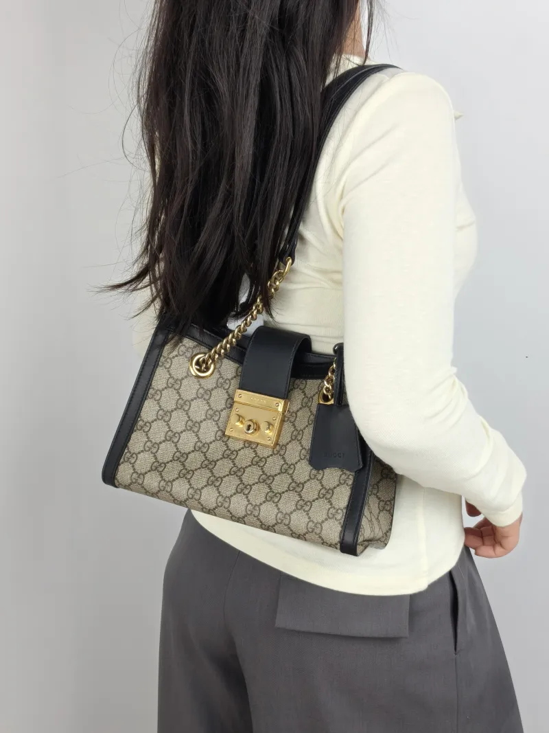 GUCCI Shoulder Bag Padlock Tote Black Monogram PVC Medium 26 × 10 × 18 cm — on-model view 1 of 2