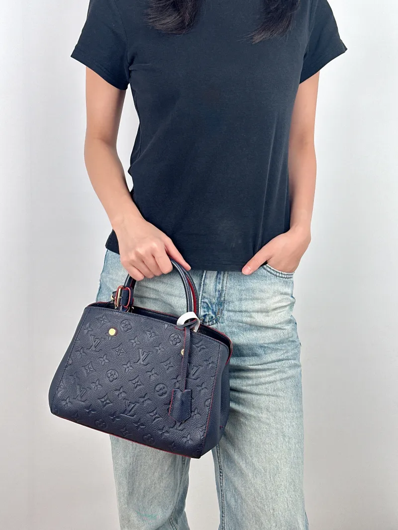 Louis Vuitton Top Handle Bag Montaigne Blue Calfskin 25 × 10 × 20 cm — on-model view 2 of 3