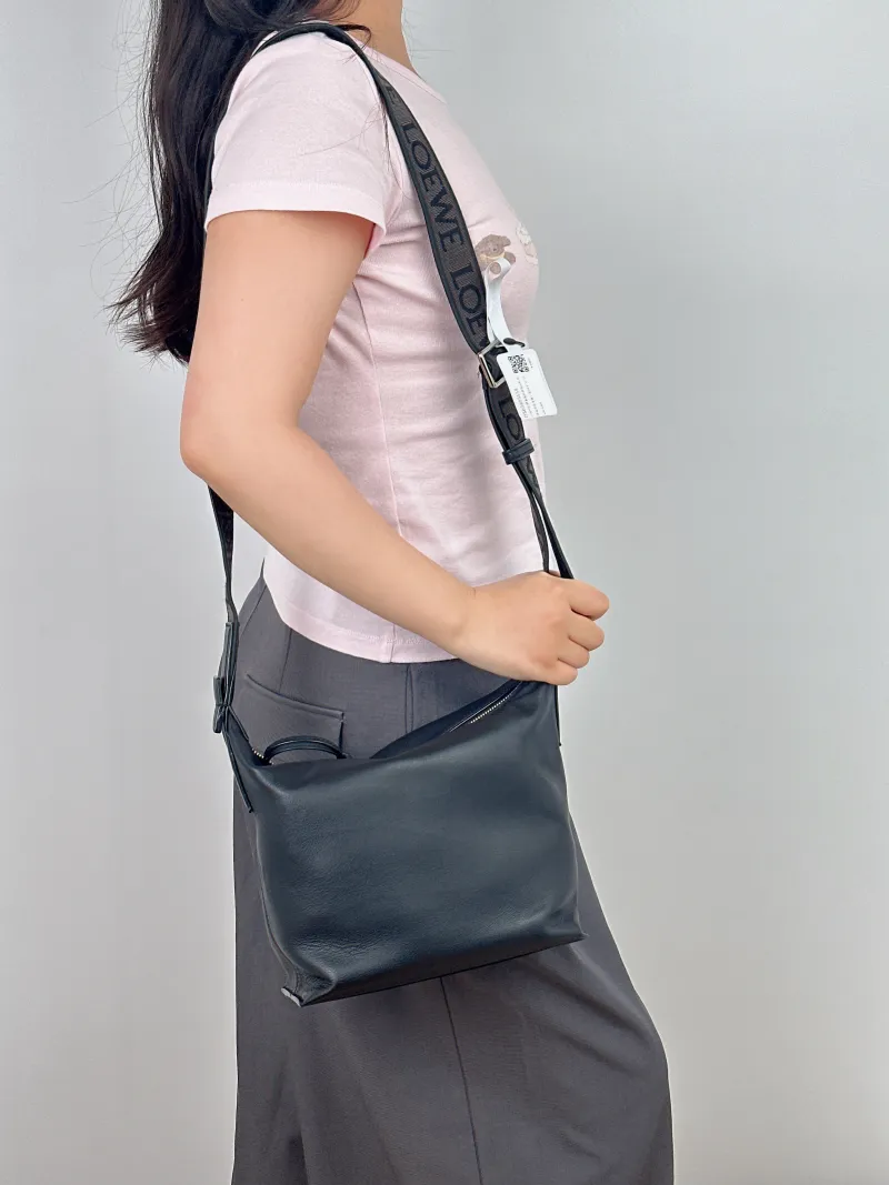 LOEWE Crossbody Bagcubi Crossbody Bag Black Calfskin Small29.5 × 10 × 22 cm — on-model view 1 of 2