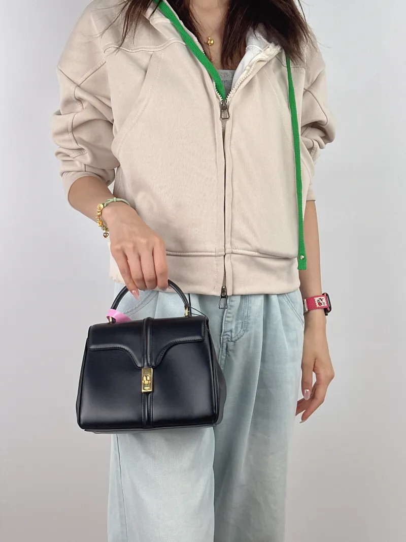 CELINE Crossbody Bag 16 Edition Black Calfskin Mini 17.5 × 7 × 14 cm — on-model view 1 of 2