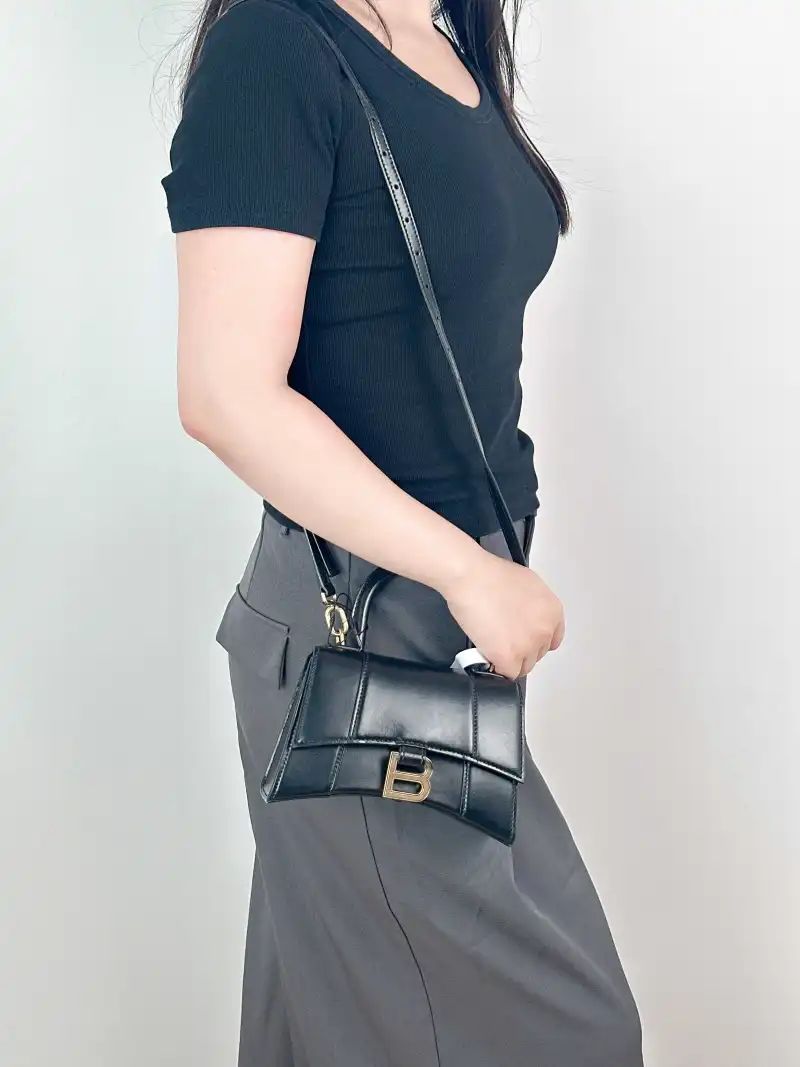 BALENCIAGA Crossbody Bag Hourglass Hourglass Bag Black Calfskin XS 19 × 8 × 13 cm — on-model view 1 of 3