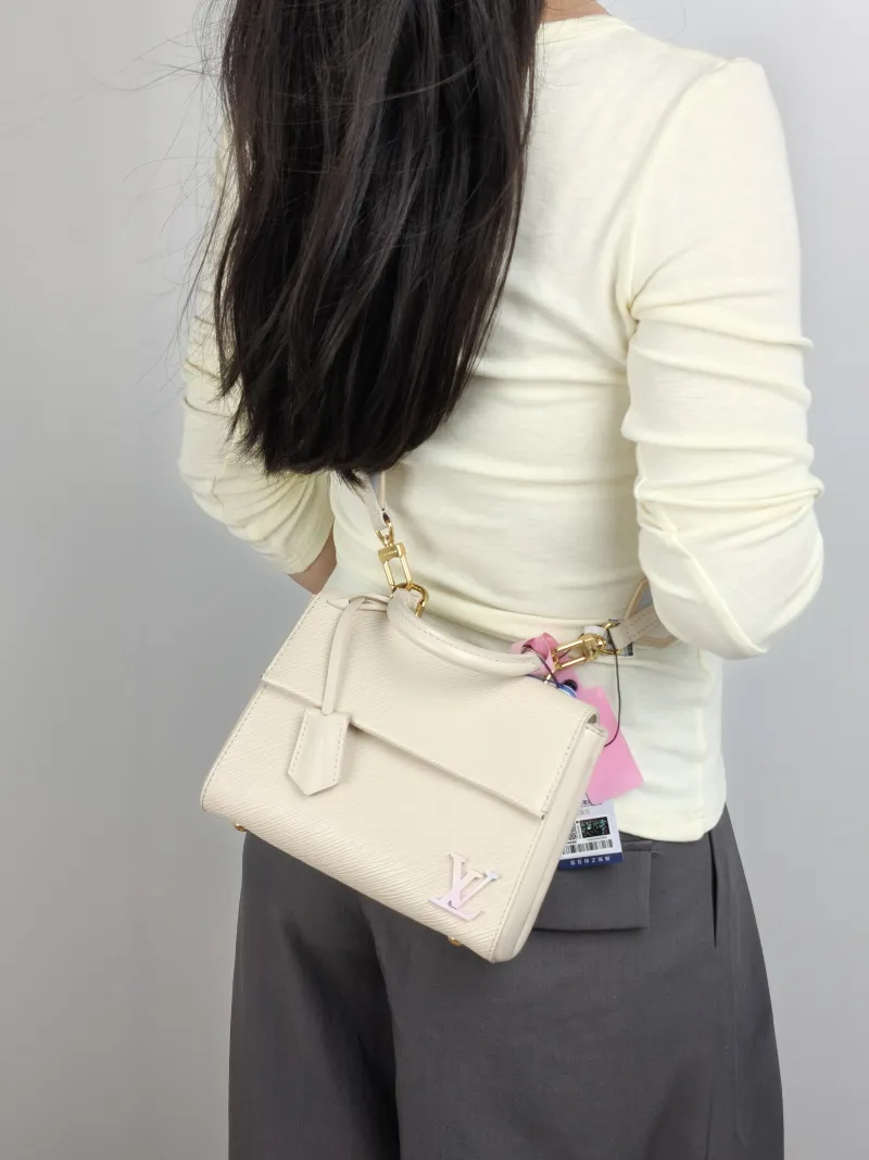 Louis Vuitton Crossbody Bag CLUNY White Epi Embossed Calfskin Mini 20 × 7.5 × 16 cm — on-model view 2 of 3