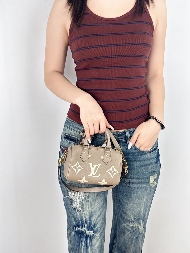 Louis Vuitton Crossbody Bag Speedy Nano · White Empreinte Embossed Calfskin Monogramnano16 × 7.5 × 10 cm — on-model view 1 of 2