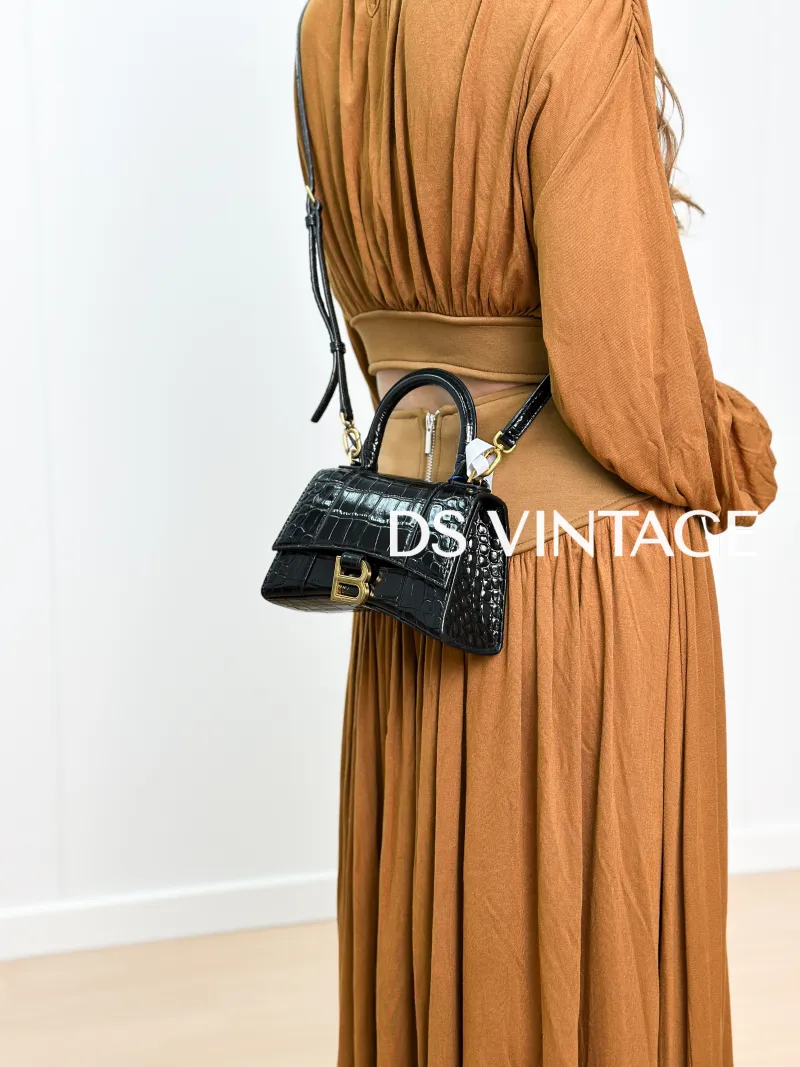 BALENCIAGA Crossbody Bag Hourglass Hourglass Bag Black CC alfskin Mini 19 × 8 × 13 cm — on-model view 1 of 3