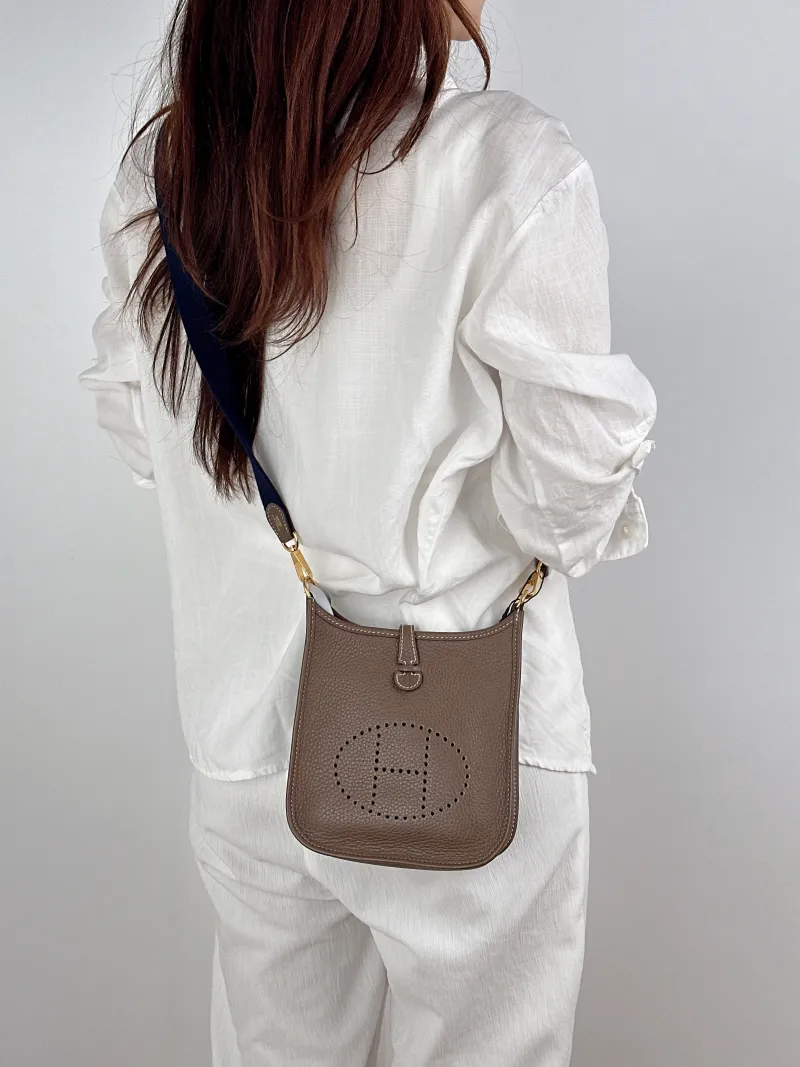 Hermès Crossbody Bag Evelyne Mini 16 Mini 1618 Taurillon Clemence TC Calfskinmini17 × 5.5 × 18 cm — on-model view 2 of 2