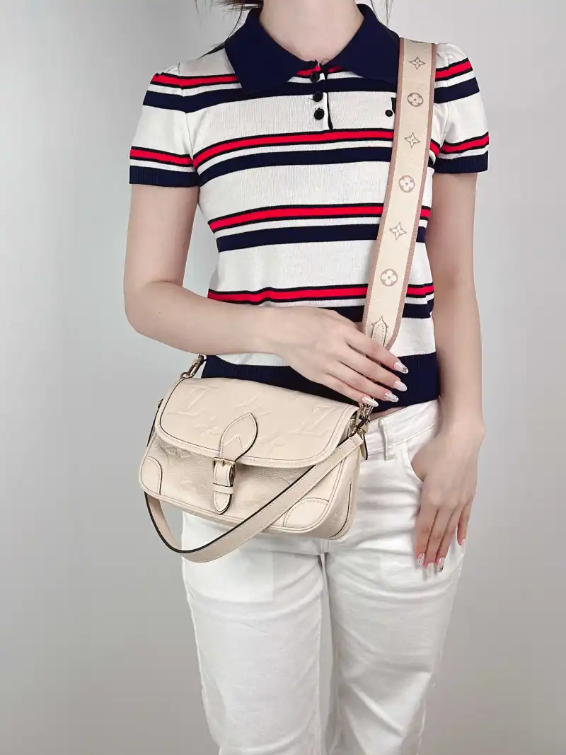 Louis Vuitton Crossbody Bag Diane Baguette Bag White Monogram Empreinte Embossed Calfskin Small 24 × 9 × 15 cm — on-model view 1 of 3