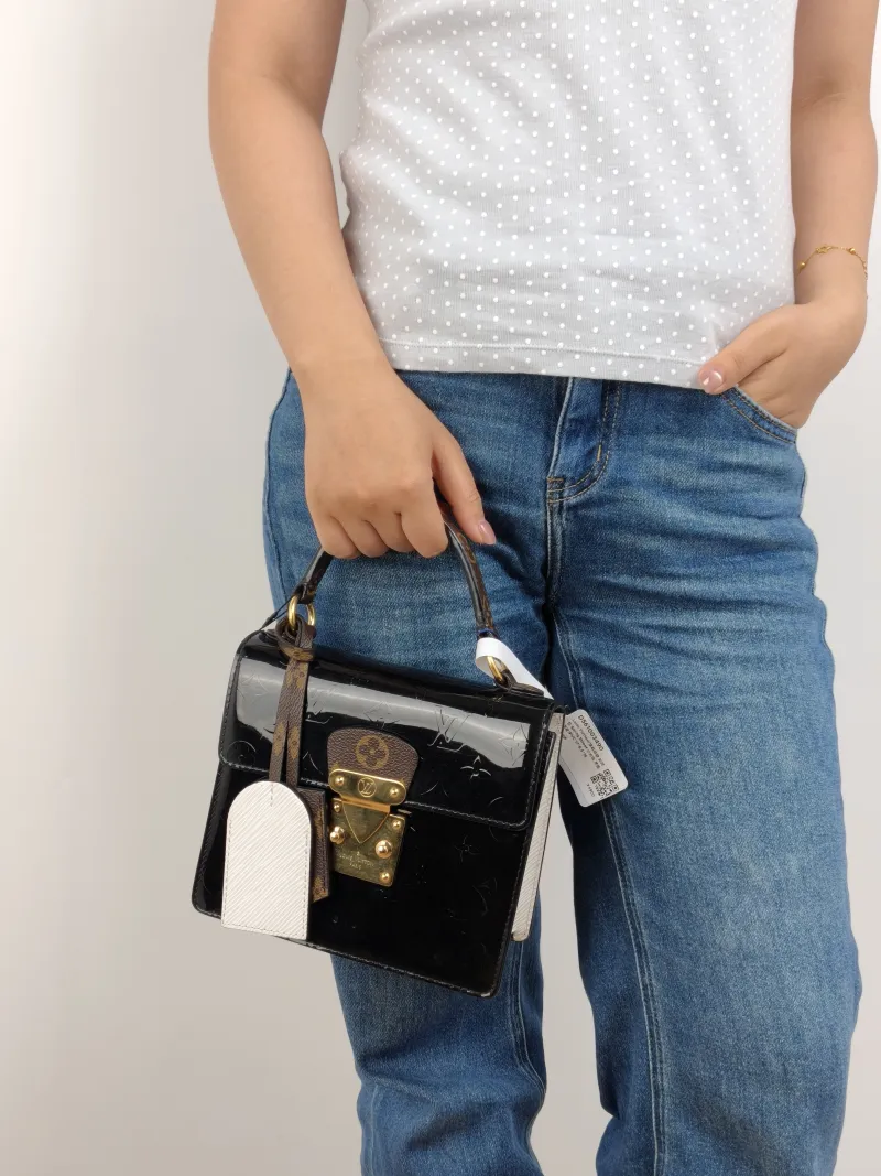 Louis Vuitton Crossbody Bag Spring Street Black Patent Leather · PVC 17 × 8.5 × 16 cm — on-model view 2 of 3