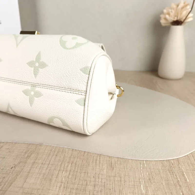 Louis Vuitton Crossbody Bag Favorite White · Green Empreinte Embossed Calfskin Monogram Medium24 × 9 × 14 cm — detail view 9 of 10