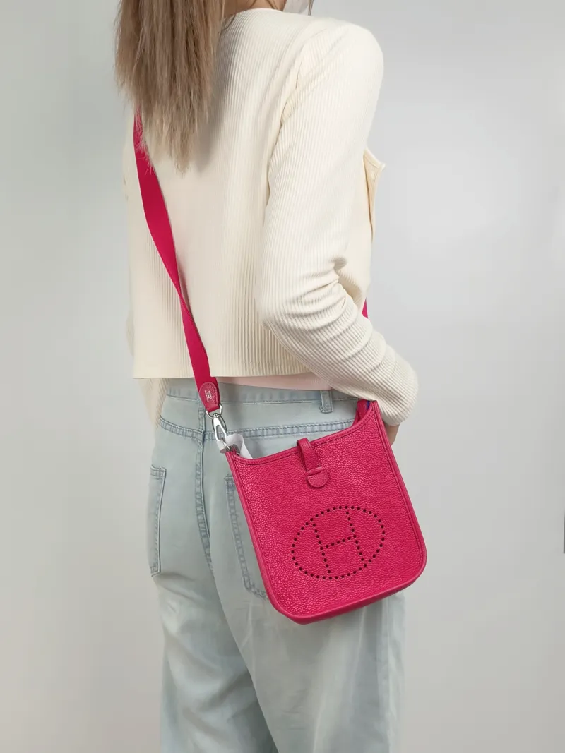 Hermès Crossbody Bag Evelyne Mini 16 Mini 16OD Rose Mexico Taurillon Clemence TC Calfskinmini17 × 5.5 × 18 cm — on-model view 1 of 2