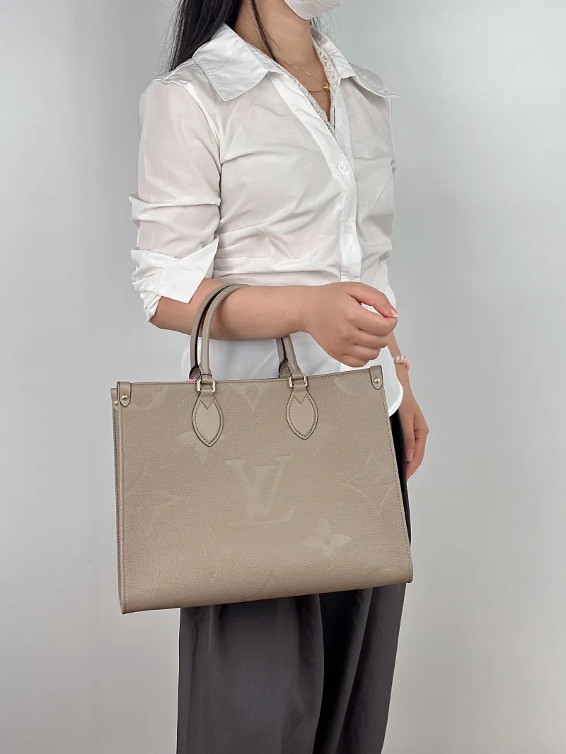 Louis Vuitton Shoulder Bag Onthego Medium Monogram Empreinte Embossed Calfskin Medium 35 × 14 × 27 cm — on-model view 2 of 2