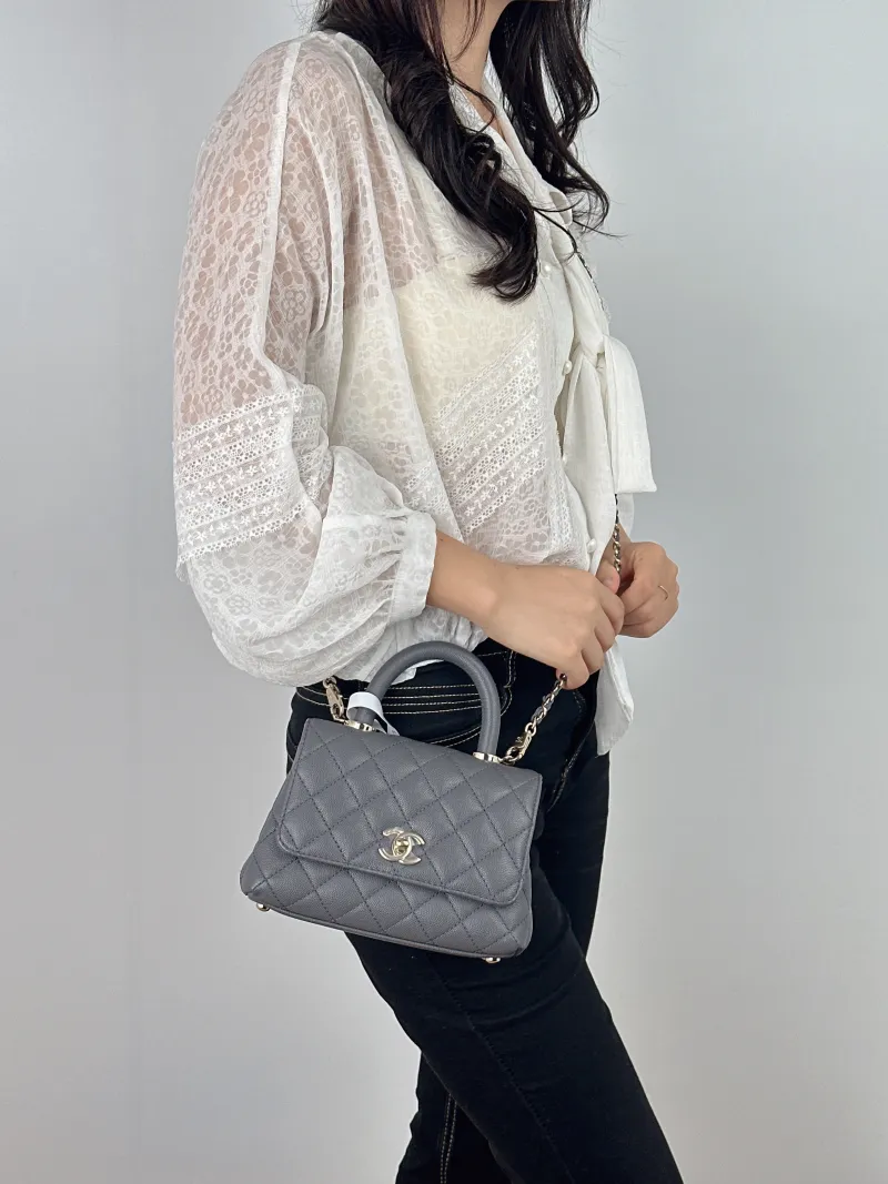 Chanel Crossbody Bag Coco Handle​ Dark Grey Grained Calfskin Mini 19 × 9 × 13 cm — on-model view 1 of 2