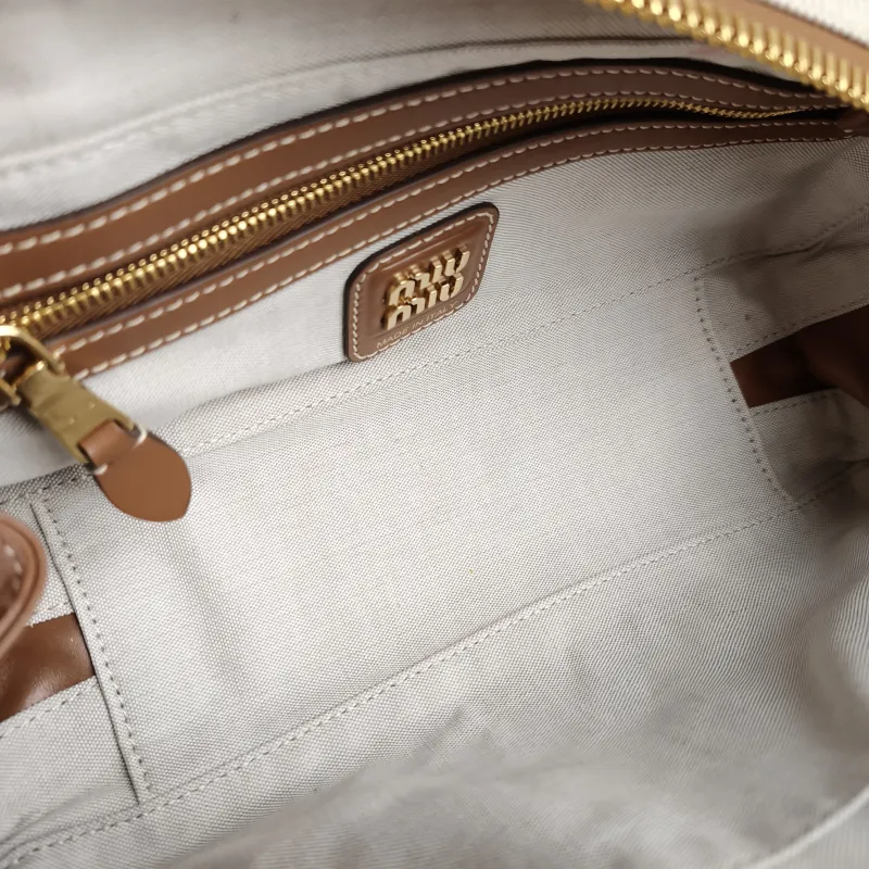 Miumiu Top Handle Bag Beau Brown Canvas · Calfskin 28 × 8 × 11.5 cm — detail view 1 of 13